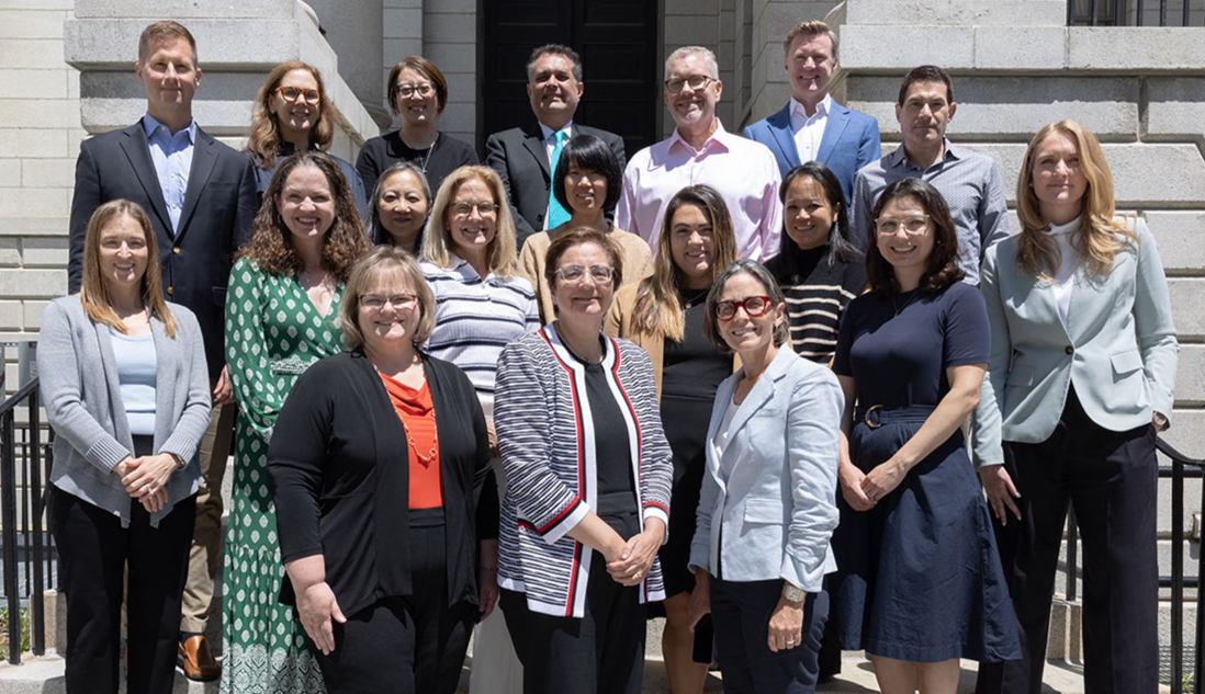 Leadership group photo on outside steps of a building in Boston